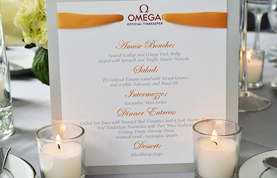 Omega menu design displayed over a place setting